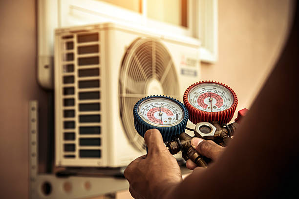 Professional Air Conditioning Service technician working in Millfield, OH